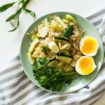 Delicious rice meal with zucchini, greens, and soft-boiled egg, perfect for a healthy diet.