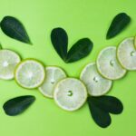 sliced lemon on green surface