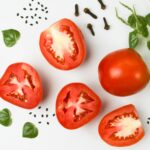 red tomato on white surface
